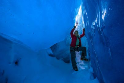 Have the chance to explore ice caves while climbing.