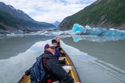 Paddling around icebergs after watching a calving event during the tour.