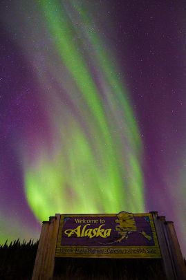 Entering back in to Alaska while chasing the northern lights along the Alaska Highway.