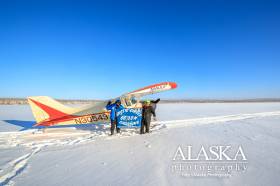 Landing at Howard Lake in the dead of winter to say you've been to the arctic circle.