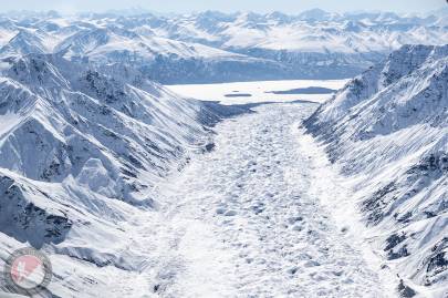 Looking down Hawkins Glacier, across Chitina River and Mount Leeper in the far distance.