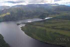 Ptarmigan Lake in Alaska with Centere Mountain the prominent top right frame, in Canada.