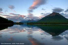 Reflections of Tanalian Mountain and Hardenburg Bay in Lake Clark, Alaska. Near Port Alsworth. Chris Zimmerman, USGS. Public domain