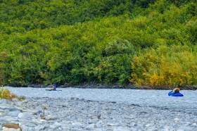 A couple float the Tsina River starting below the lower pipeline access bridge after the first canyon.