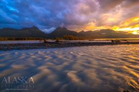 Sunset on Valdez Glacier Stream with Port Valdez and Sugarloaf Mountain in the background.