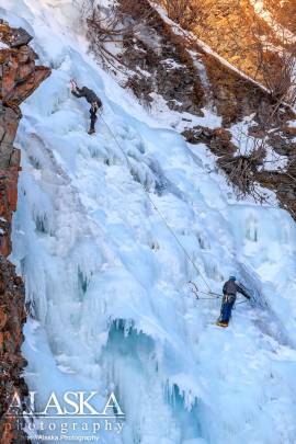 Climbers make their way up the top of Horsetail Falls during the Valdez Ice Climbing Festival.