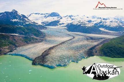 Alsek Glacier empties into Lake Alsek. Mount Fairweather peaks out on the right of the frame. Taken July 2009.