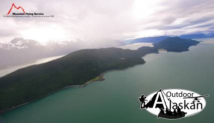 Looking across the Chilkat Peninsula. Chilkat River on the back side, meeting 
 Chilkat Inlet at Pyramid Island. Glacier Point mid-left frame at the river mouth. Lynn Canal the front body of water becoming Chilkoot Inlet.