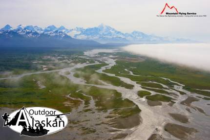 A massive fog bank moves in from the Gulf of Alaska towards the East Alsek and Doame Rivers. Whilest Mount Fairweather looms above the other mountains of the Fairweather Range.