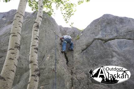 Climbing up the middle route on West Grapefruit Rocks.