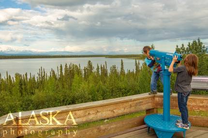 Kids play with the spotting scopes at the Willow Lake pull-off along the Richardson Highway.