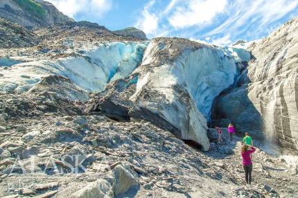 People hike up to the base of Worthington Glacier for a closer look. It's fairly steep to consider going past this point.